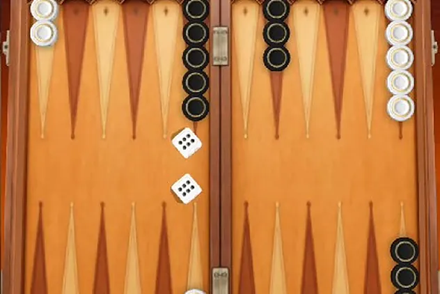 A backgammon board in the middle of a game